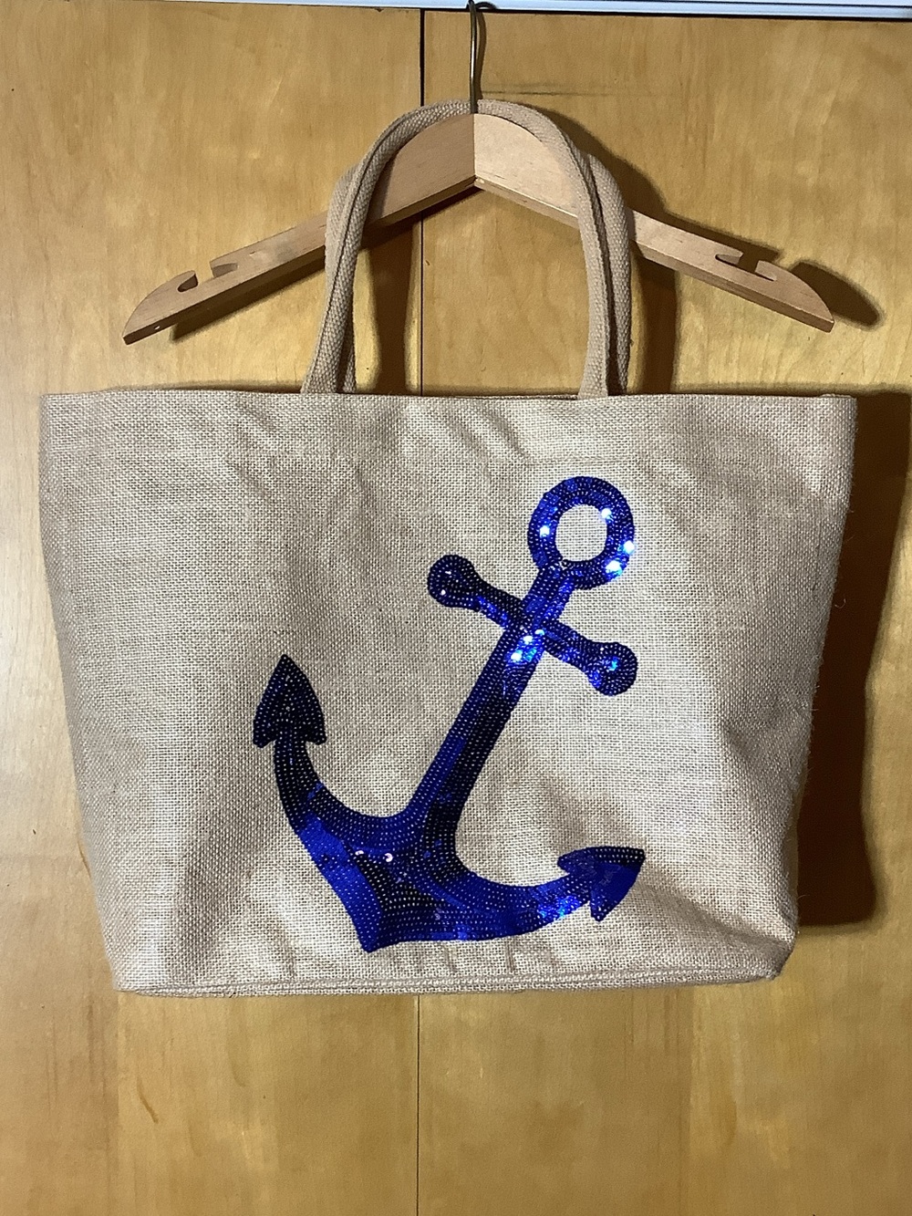 Sequined blue anchor on laminated jute tote